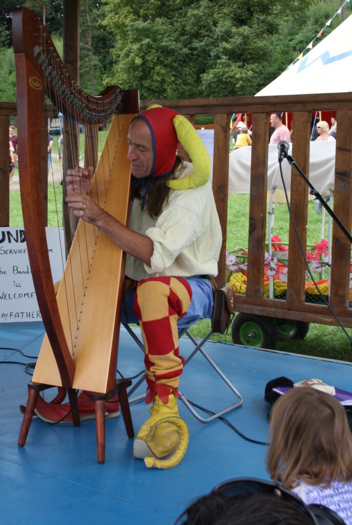 devilstick peat, magician, jester, juggler, joker, harpist and medieval fool